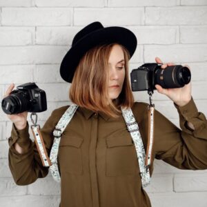 Photographer with double sling camera strap