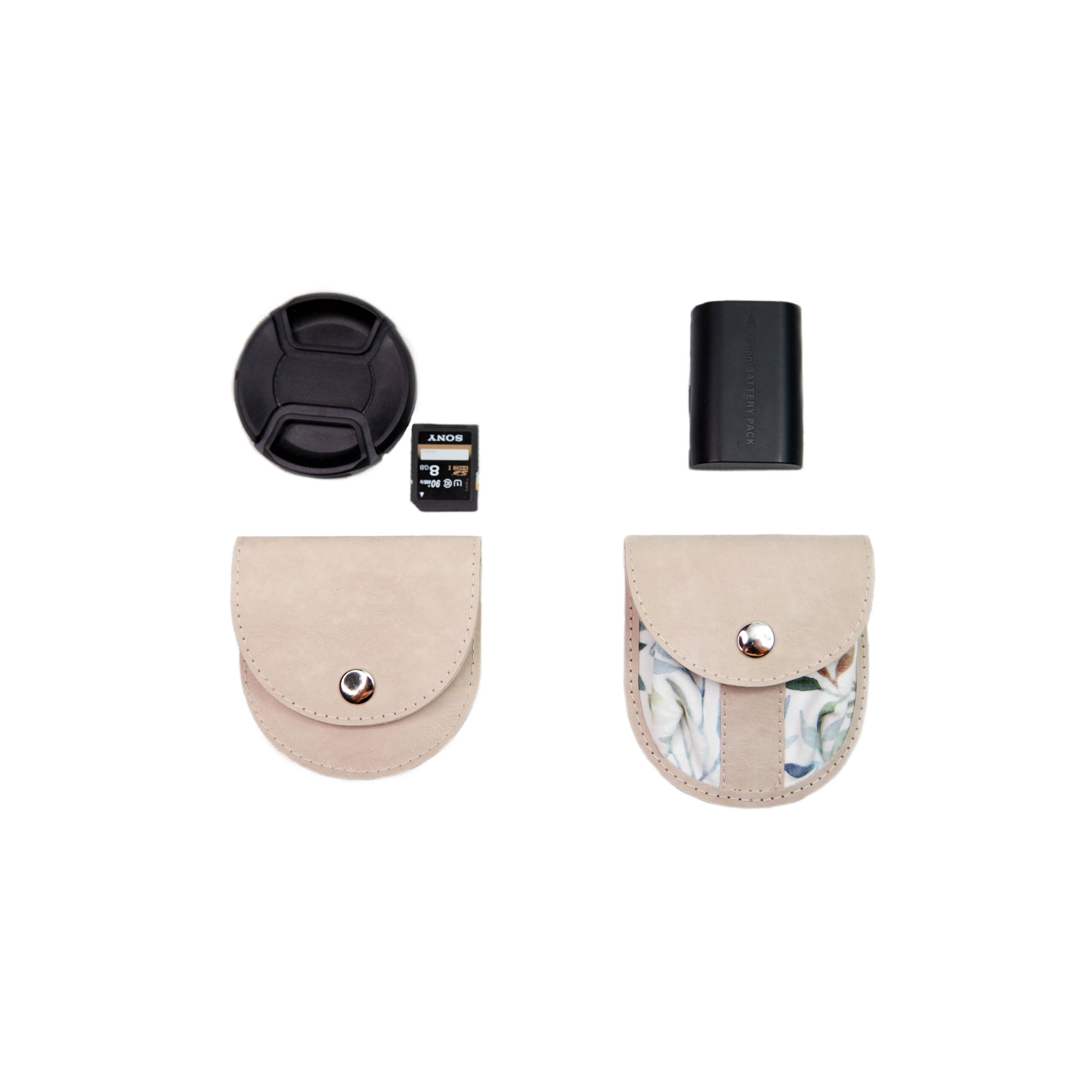 lens cap holder and battery pocket